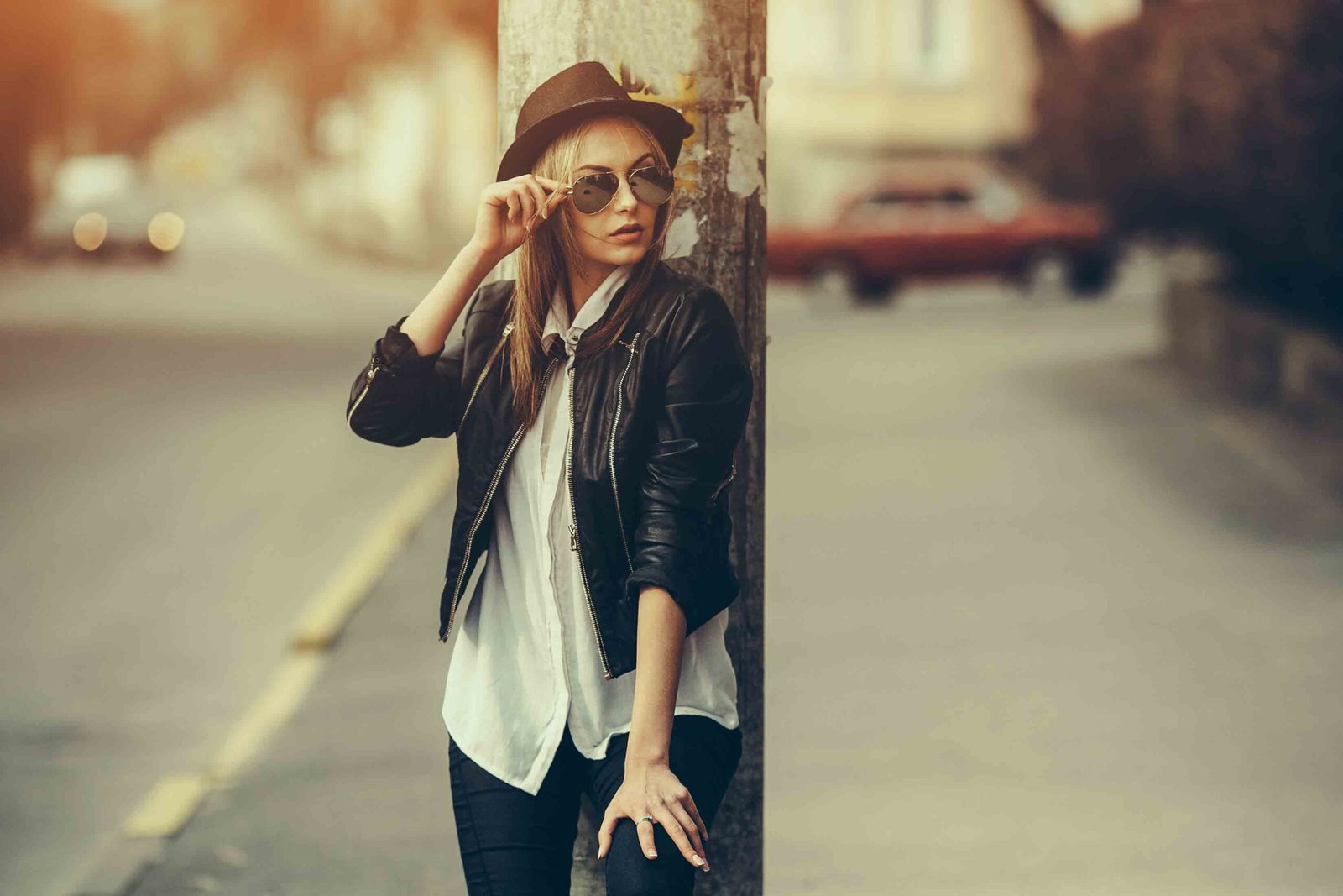 A classic white button-down shirt paired with black skinny jeans